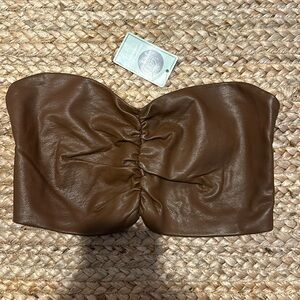 Size medium. Never worn and new with tags.